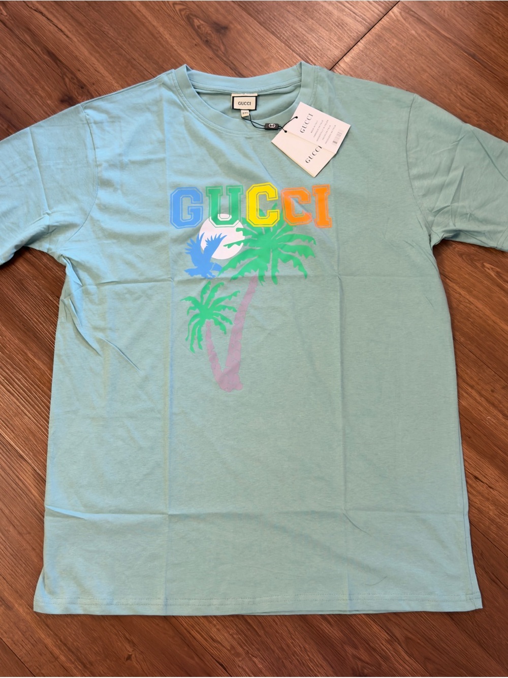 Gucci Light Blue Short Sleeve Tee with Rainbow Logo and Palm Graphic